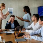 Employees navigating workplace politics